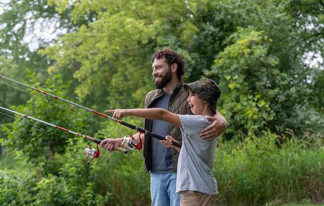 a man and a child fly fishing