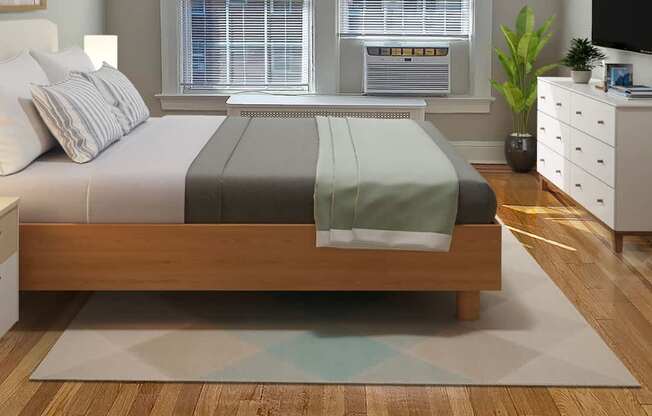 A bedroom with a bed, a dresser, and a window.