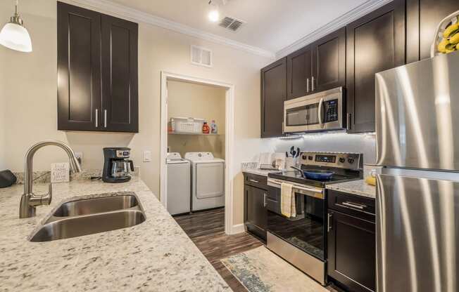 Granite Counter Tops In Kitchen at The Oasis at Moss Park Preserve, Orlando