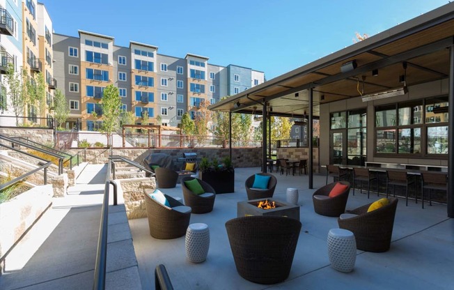 Outdoor Living Area Including Bbq'S And Fire Pits at Tivalli Apartments, Lynnwood, WA, 98087