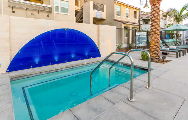 A swimming pool with a blue tinted cover.