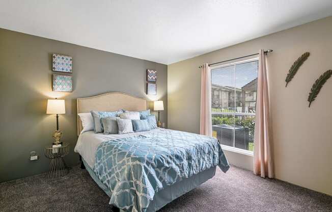 a bedroom with a bed and a window
