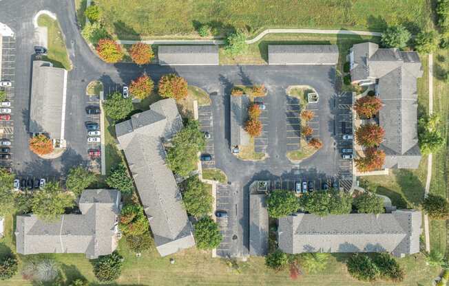 an aerial view of a neighborhood with houses and trees