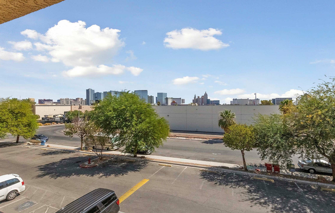 Enjoy breathtaking city views from your private balcony, surrounded by vibrant greenery.