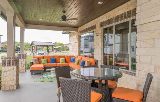 A patio with a table and chairs.