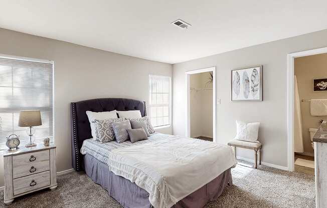 a bedroom with a large bed and a closet