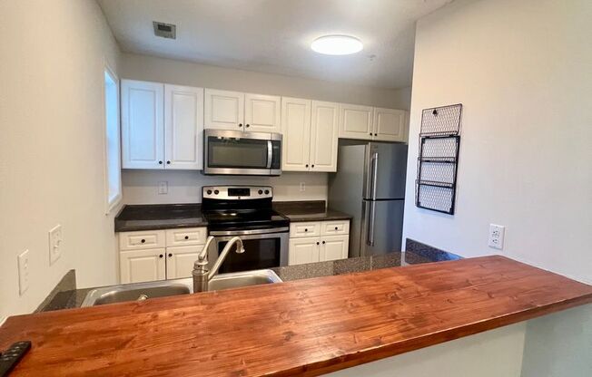 Freshly Painted! New Luxury Vinyl Plank Floors! Updated Lighting! Pool View Unit! Cape Cottages Coastal 3 bedroom, 2 bath condo near UNCW and CFCC! Pool, Tennis, Volleyball and Clubhouse