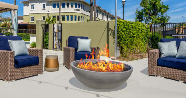 pool area chairs and a fire pit