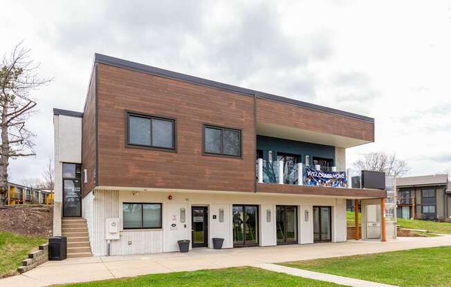 A modern building with a brown and white exterior.