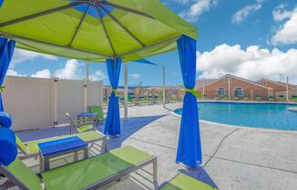 a blue umbrella sitting on top of a beach