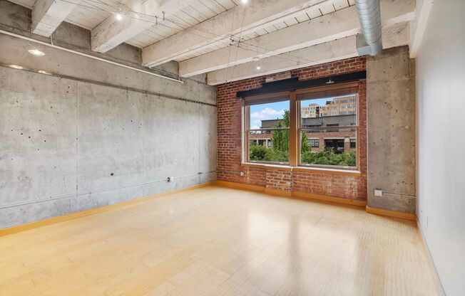Historic Chown Pella Lofts - east facing studio w/parking/most utilities/rooftop deck