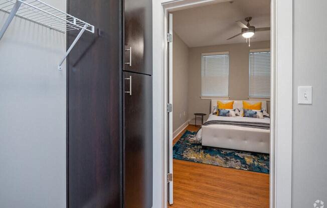 a bedroom with a bed and a closet