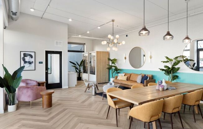 A modern dining room with a wooden table and chairs.
