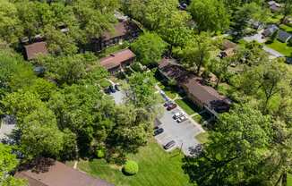 an aerial view of a neighborhood of houses and trees