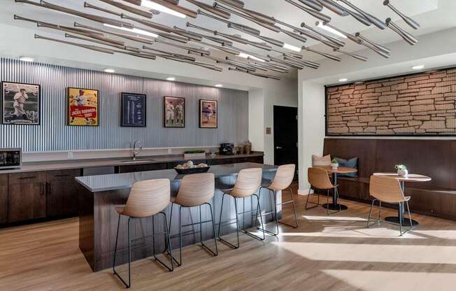 A modern kitchen with a bar area and seating.