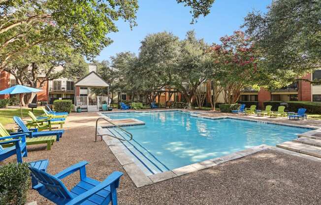 Pool with steps going into water at Hunters Chase in Austin, TX