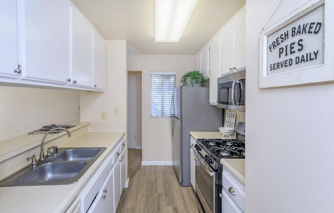 a kitchen with a sink and a window