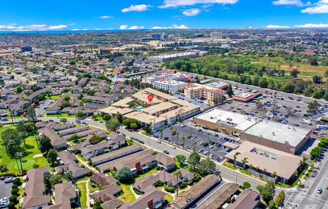 an aerial view of a city with a parking lot and buildings at Casa Del Amo Apartments, California