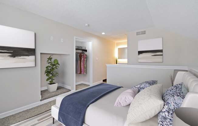 a bedroom with a bed and a closet