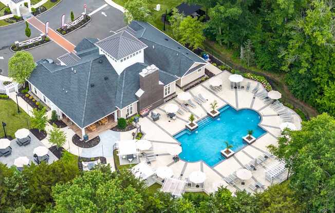 A large house with a pool in the backyard.
