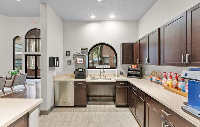 A kitchen with brown cabinets and a white counter.