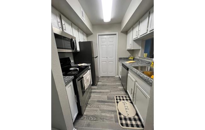 a kitchen with a building in the background