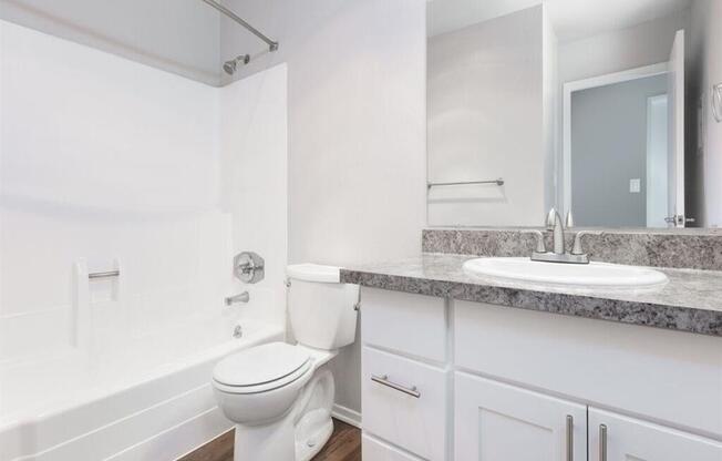 a white bathroom with a sink and a toilet  at Skyline Heights LLC, California
