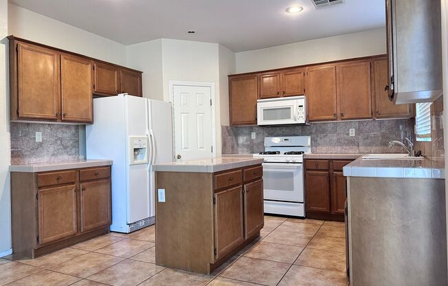 Welcome to this beautifully maintained two-story home offering 4 spacious bedrooms and 3 full bathrooms, including a convenient downstairs bedroom with its own shower—ideal for guests or multi-generational living.