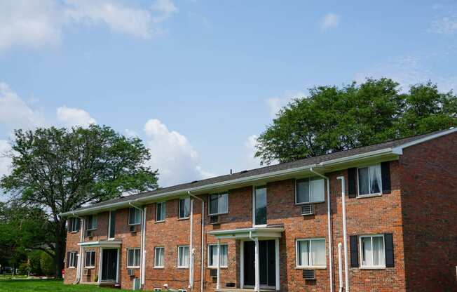 Apartment building with windows and entry doors, at Gale Gardens Apartments