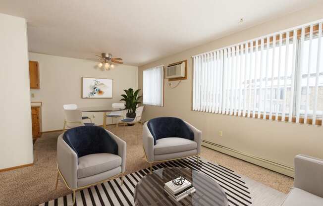 Fargo, ND Park Circle Apartments. a living room with two chairs and a coffee table