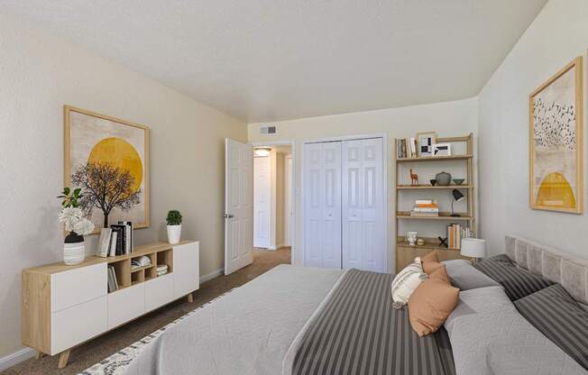 A bedroom with a bed, dresser, and a painting on the wall.