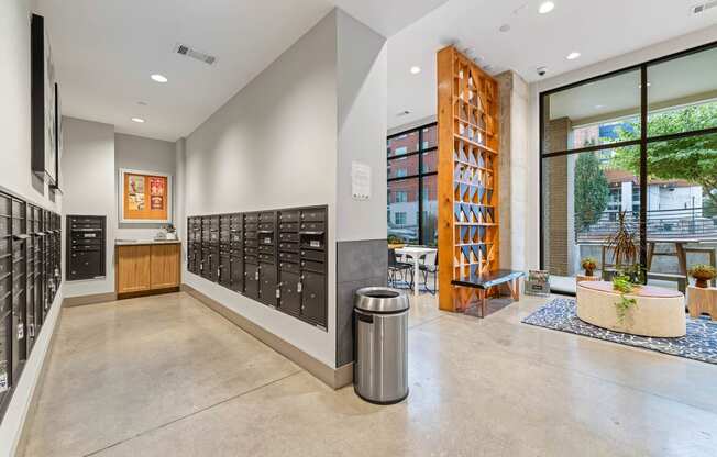 the entrance to the building has a large wall of wine racks