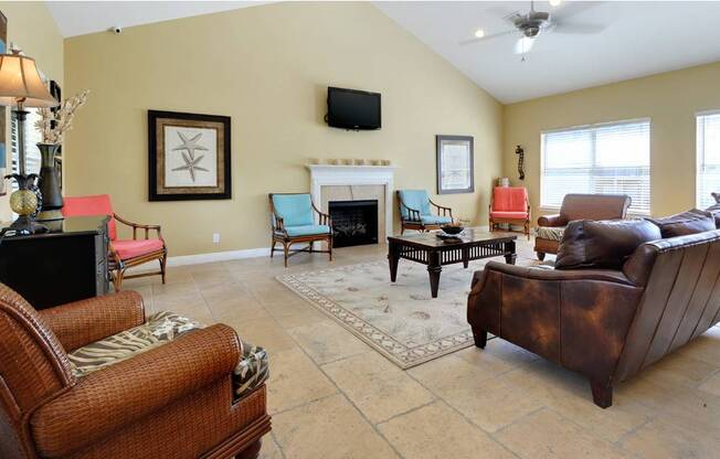 A living room with a fireplace and a television.