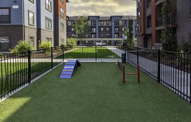 a rendering of a dog park in the middle of an apartment complex