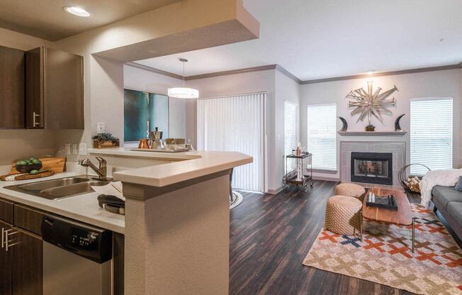 a kitchen and living room with a fireplace