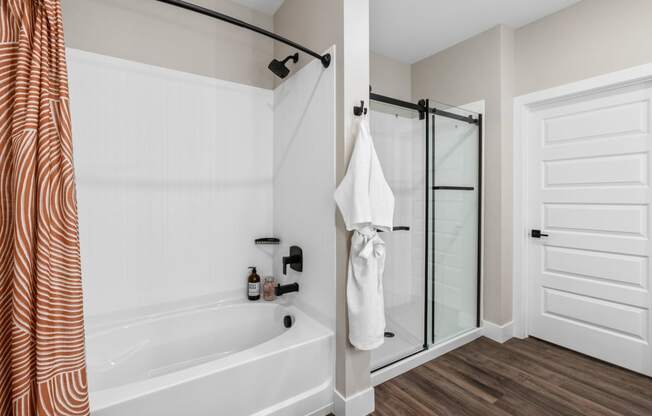 the preserve at ballantyne commons apartment bathroom with tub and shower