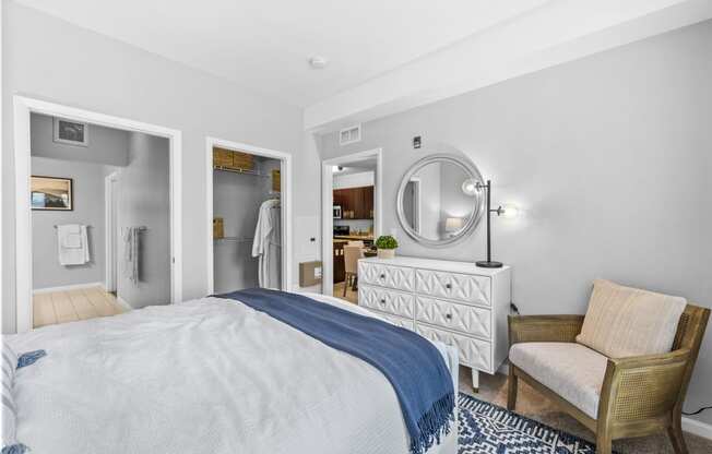 a bedroom with a bed and a chair  at Harbor Pointe, New Jersey