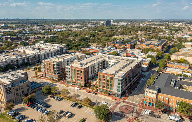 A cityscape with buildings and cars.