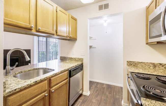 This is a photo of the kitchen in the 1245 square foot 2 bedroom, 2 bath apartment at Cambridge Court Apartments in Dallas, TX.