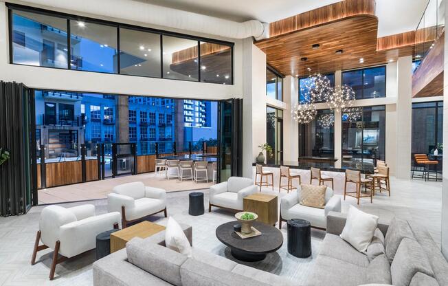 This sophisticated clubroom effortlessly blends elegant interiors with an inviting outdoor patio.