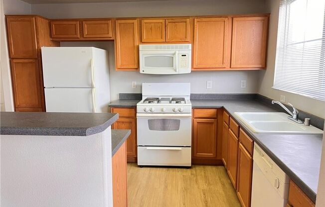 Bright 2-Bed Condo with Dual Balconies, Garage & Community Amenities!
