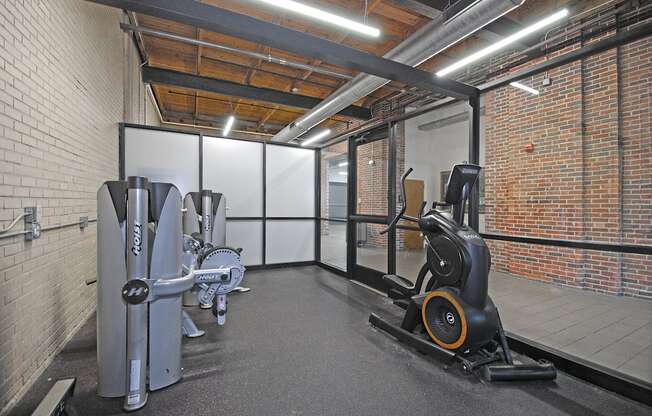 Apartments with a gym in Grand Rapids. Weight machines, free weights, punching bag.