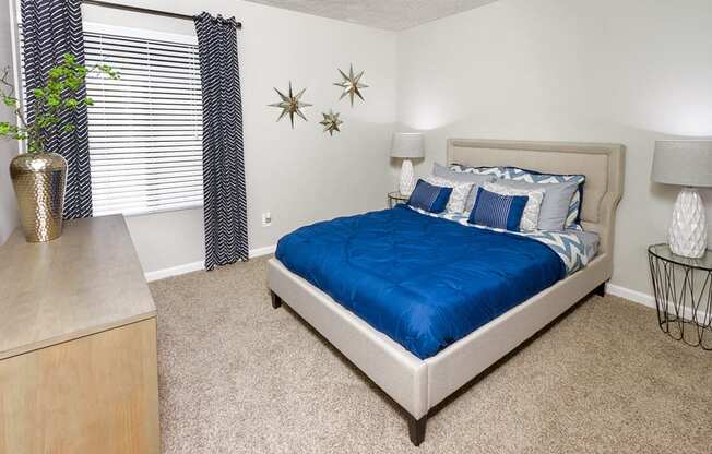 Apartments in Downey for Rent - Park Regency Club Apartments Bedroom With Carpeting, Large Window and Stylish Decor