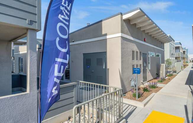 a building with a blue flag in front of it at Loma Villas Apartments, California