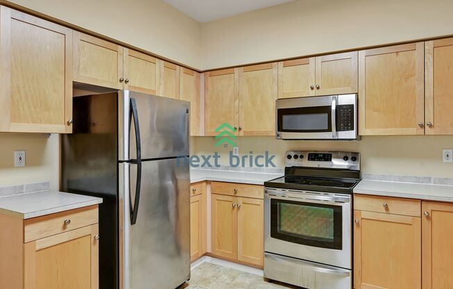 Rare Ground-Floor, End Unit with massive bonus office and Private 2-Car Garage!