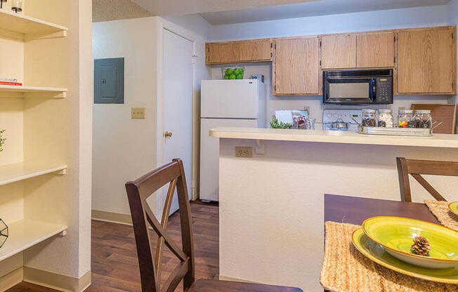 ridgepointe spacious kitchen with wood flooring and plenty of cabinetry