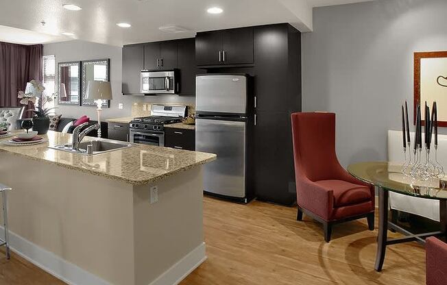 a kitchen with a stove top oven next to a table