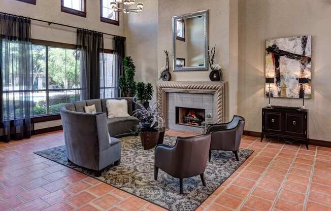 A living room with a fireplace and a mirror on the wall.