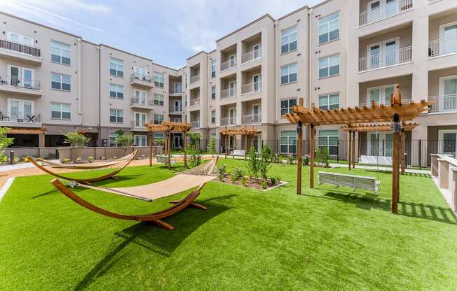Courtyard with hammocks at Residences at 3000 Bardin Road, Grand Prairie, TX