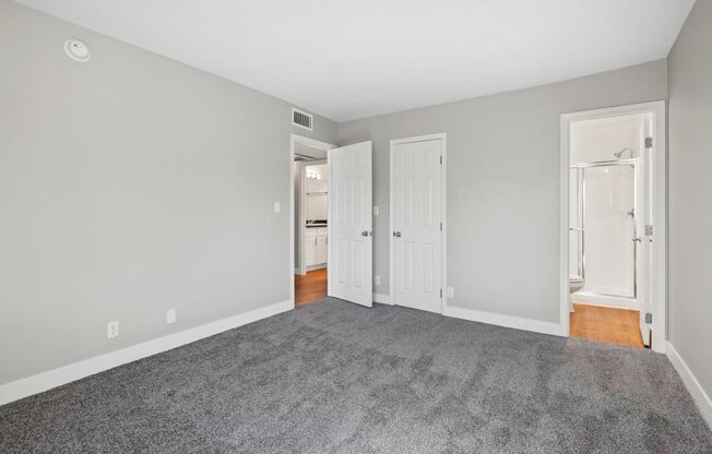 Reserve at Warner Center Apartments in Woodland Hills, CA with wall to wall carpet, stylish decor, and white walls